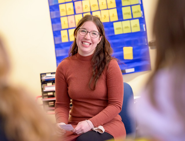 Teacher teaching in front of classroom