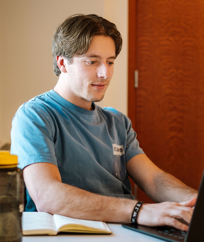 A student works on a laptop