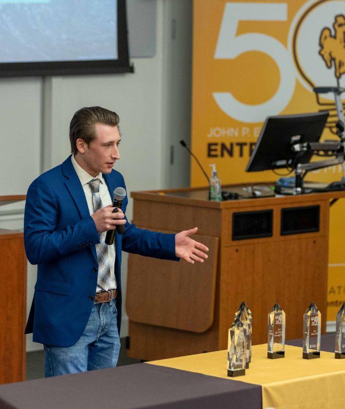 Entrepreneurship student speaking into a microphone