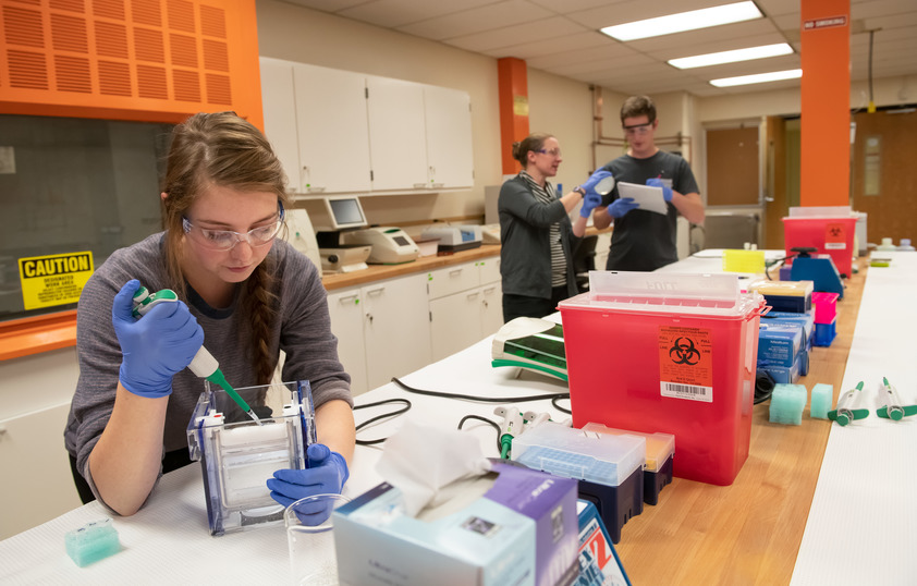Professor and students in lab