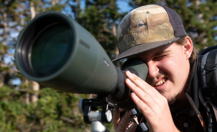 A graduate student captures a photo out in the field