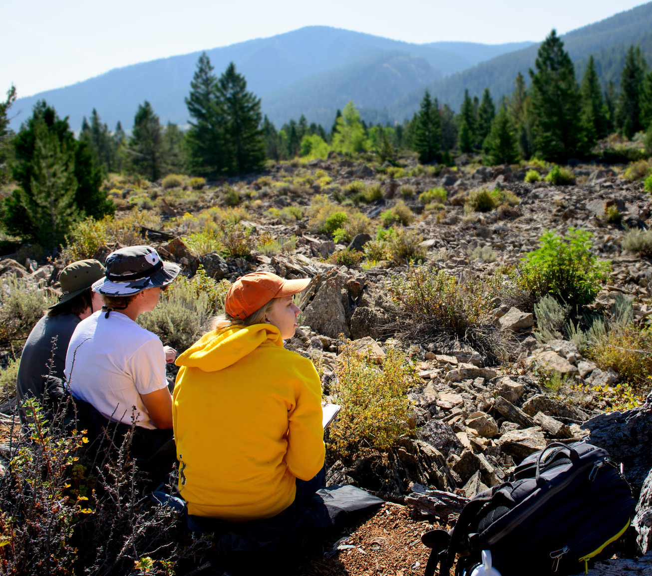 Three students out in the field