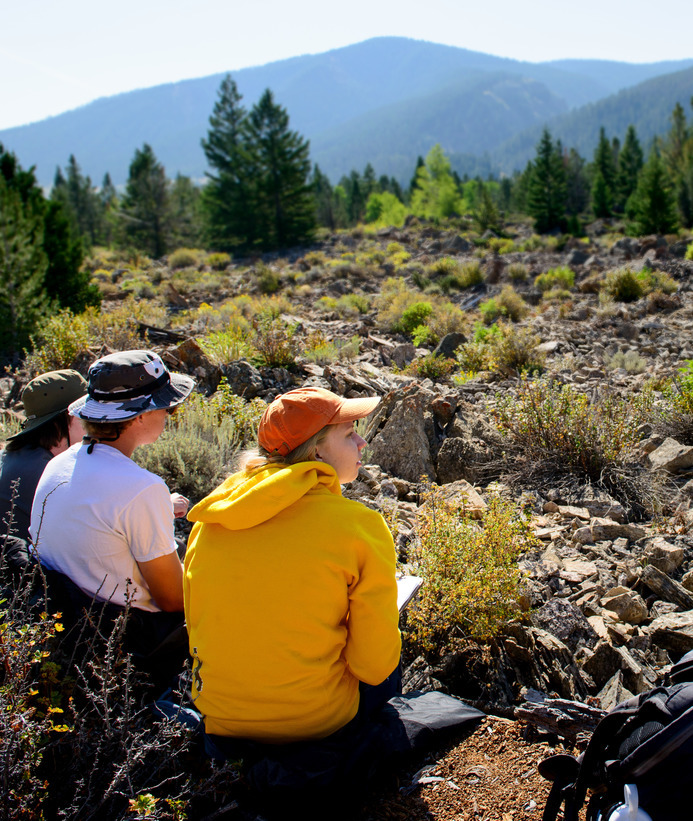 Three students out in the field