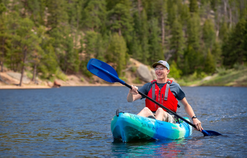 A student kayaks