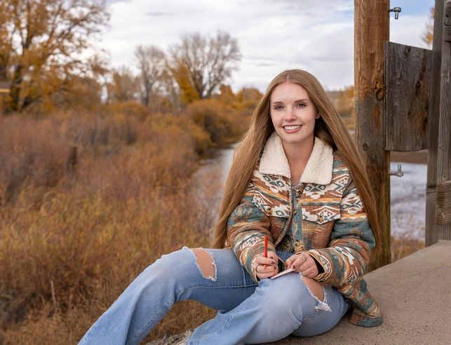 An environmental values student smiles for a picture