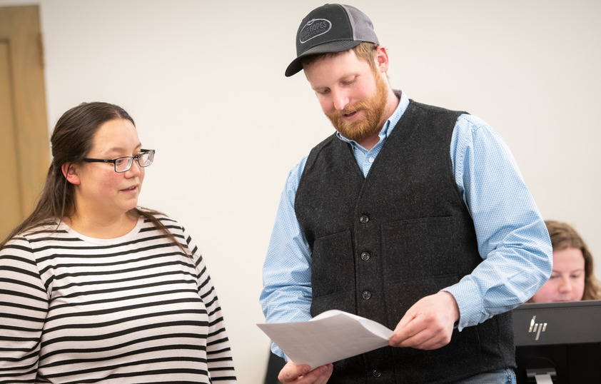 Student and professor talking during class