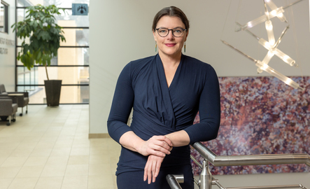 A professor smiles for a photo