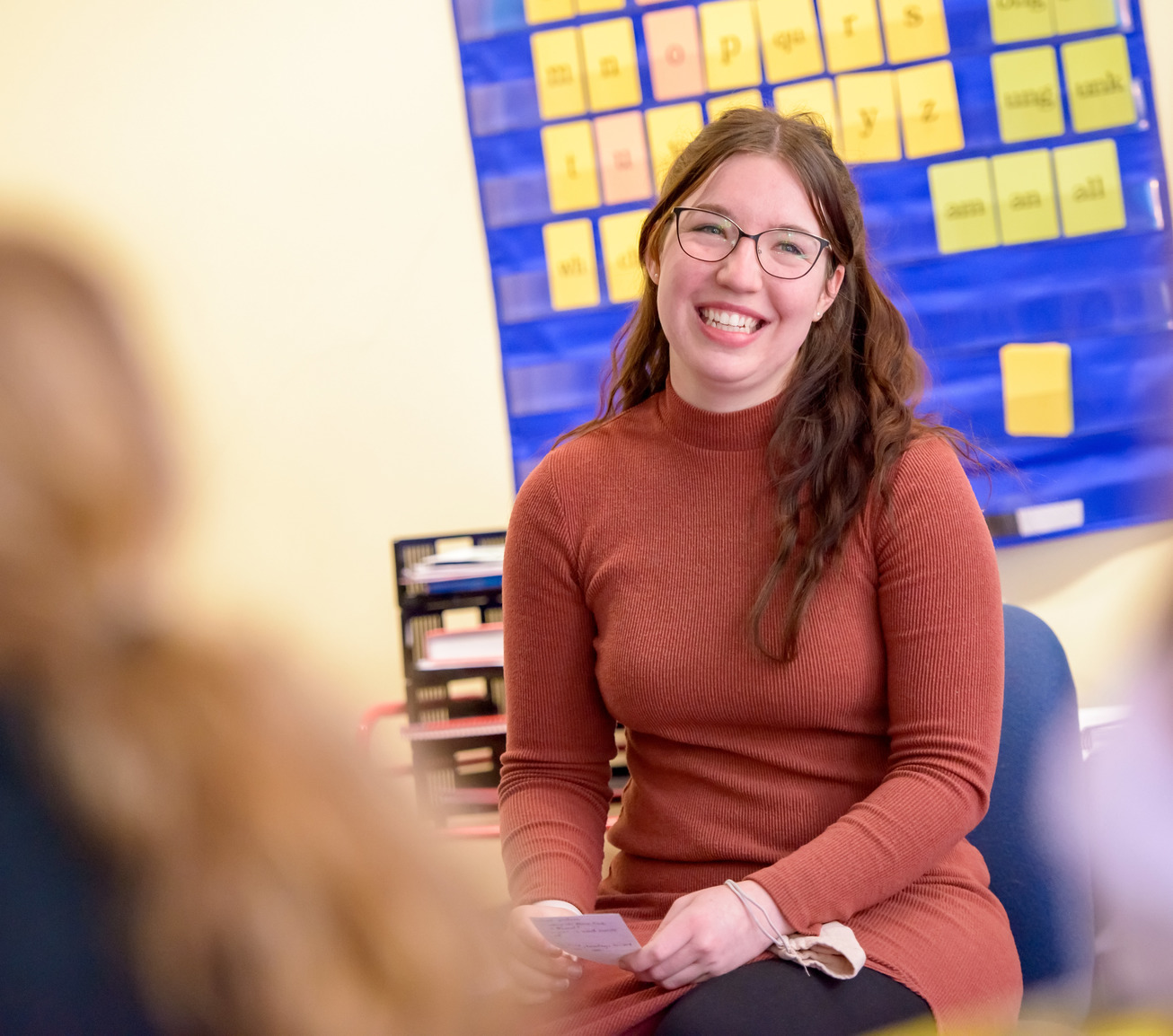 Teacher teaching in front of classroom