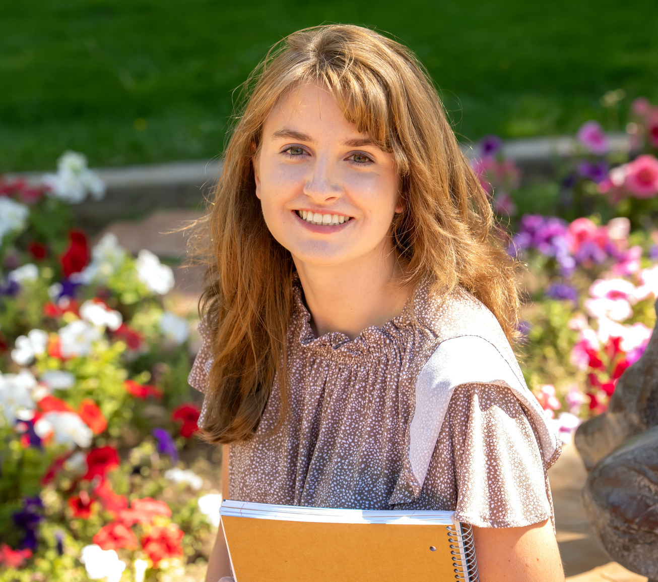 A student smiles for a photo