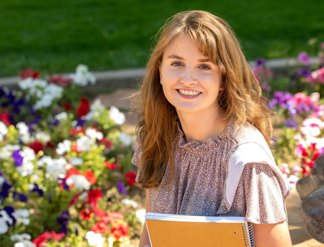 An ethics minor student smiles for a photo