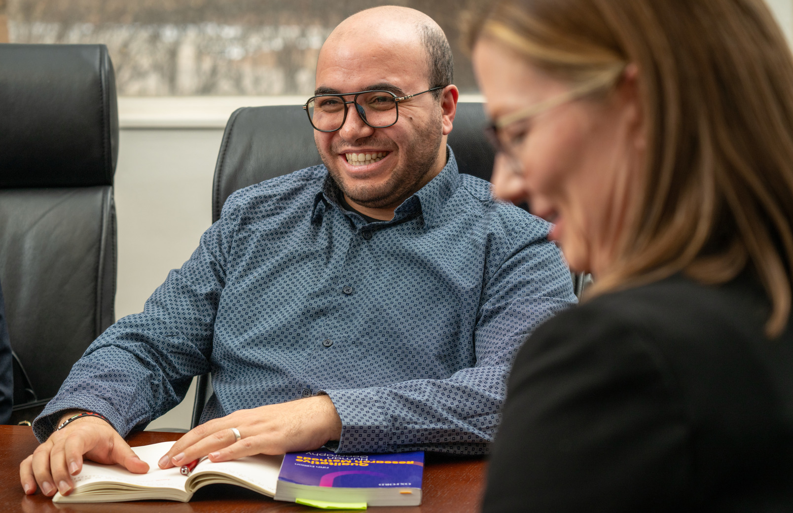 A student smiles during a meeting