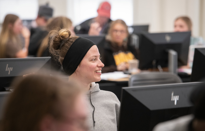 A student smiles during class