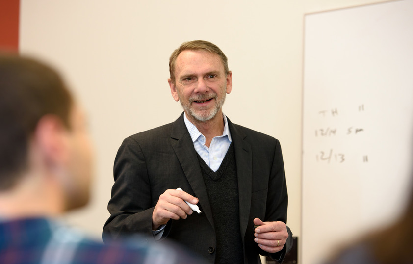 A College of Business faculty member speaks to their class.