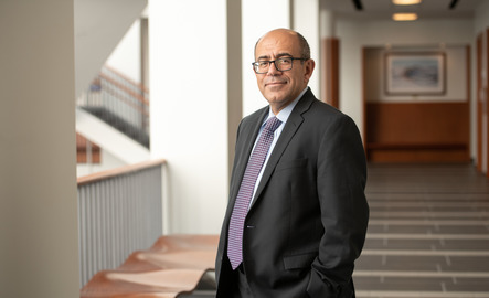 Finance professor standing in the College of Business