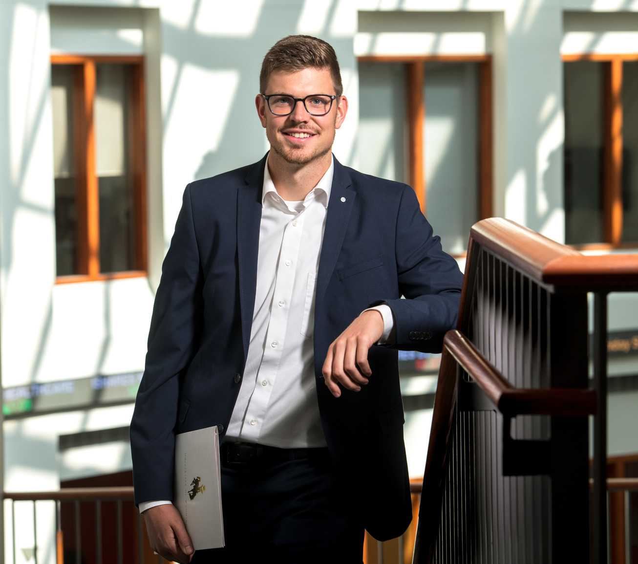 Student standing in College of Business