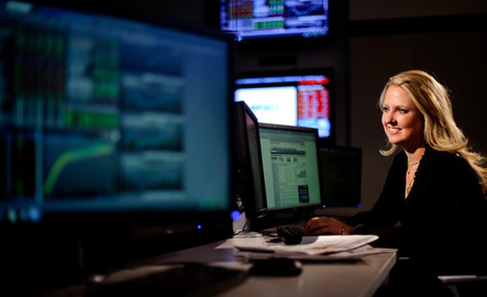 A finance student works on a computer