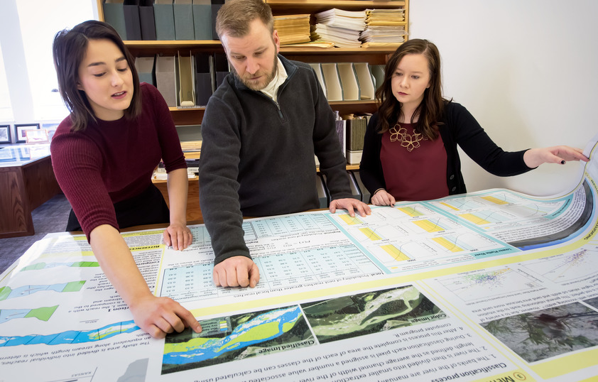 People looking at maps