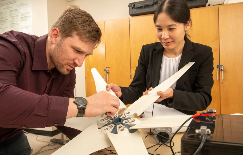 Two people building a technology