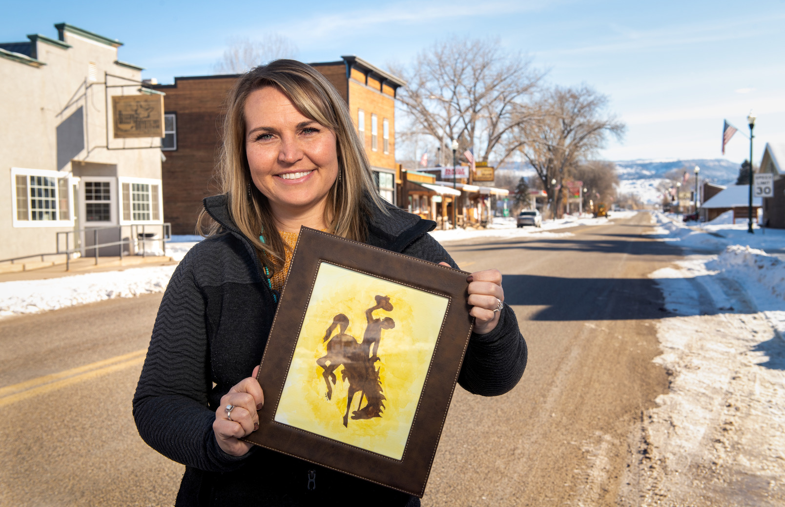 Alumni with bucking horse frame