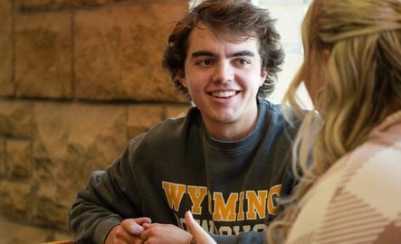 Two students working together in a coffee shop