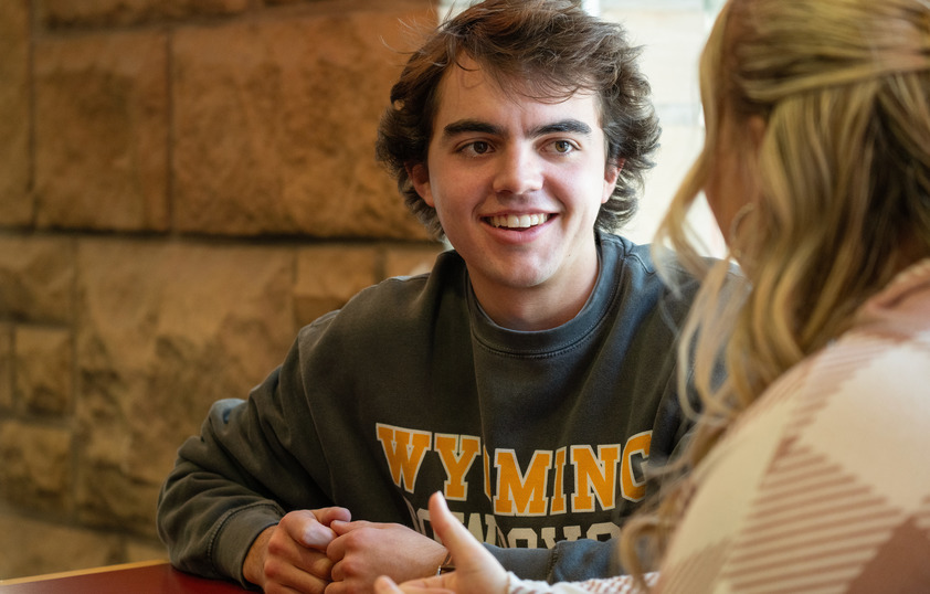 Two students working together in a coffee shop
