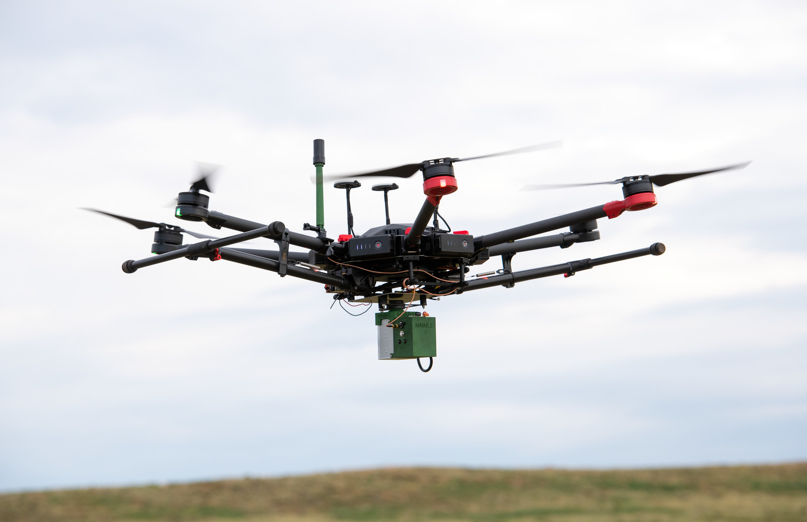 Drone flys in a field