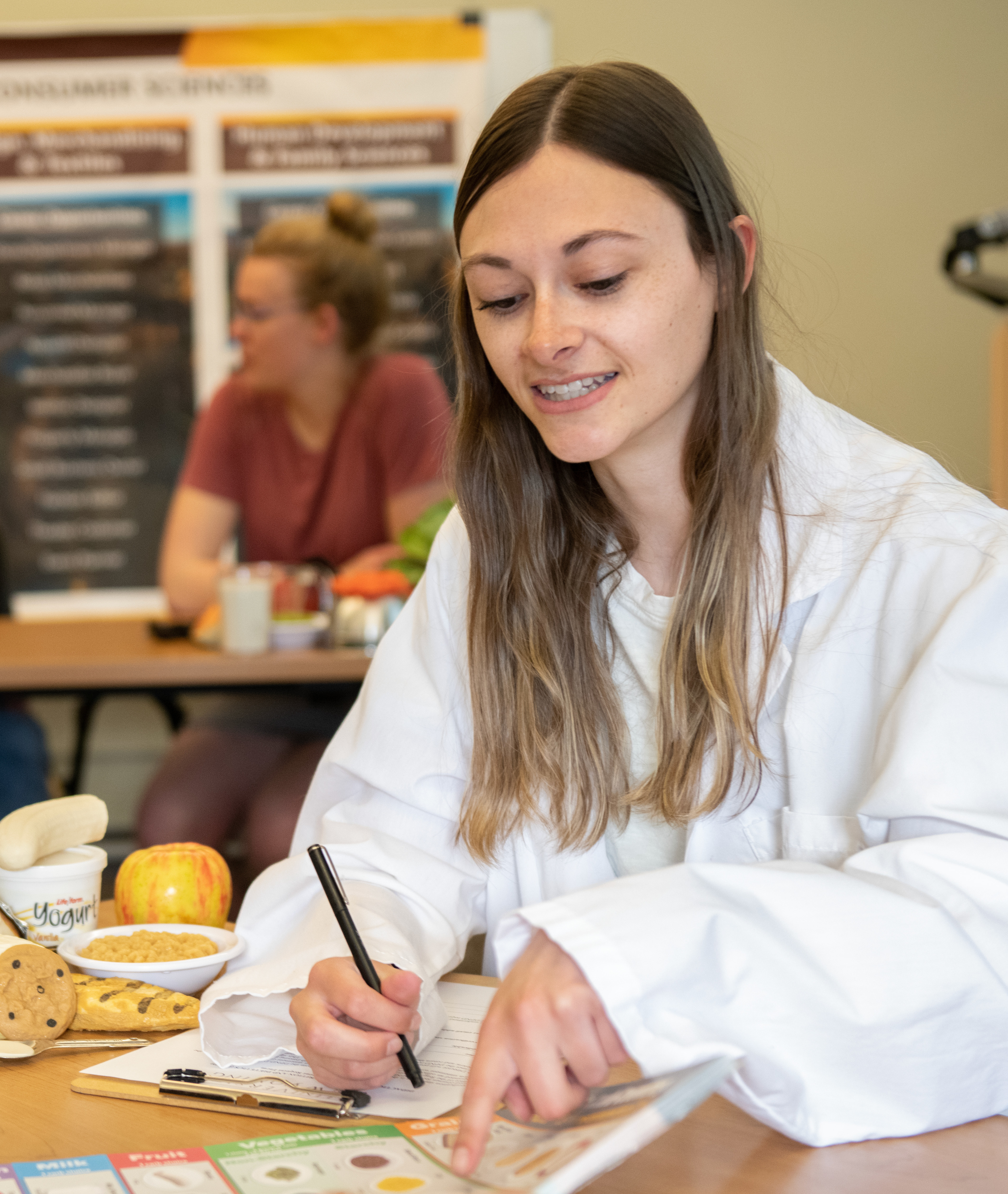 A dietetics student in class