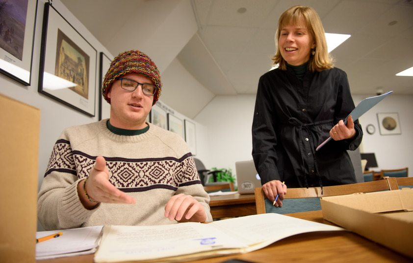 Professor helping student during class
