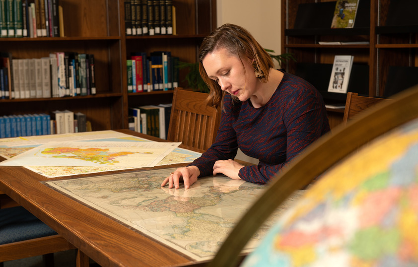 Student examining map