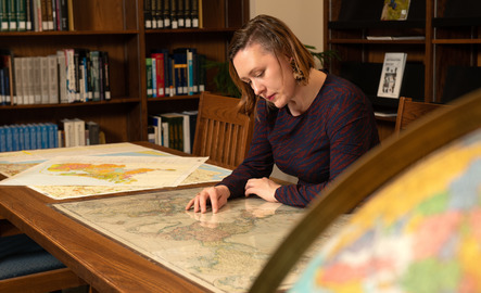 Student examining map