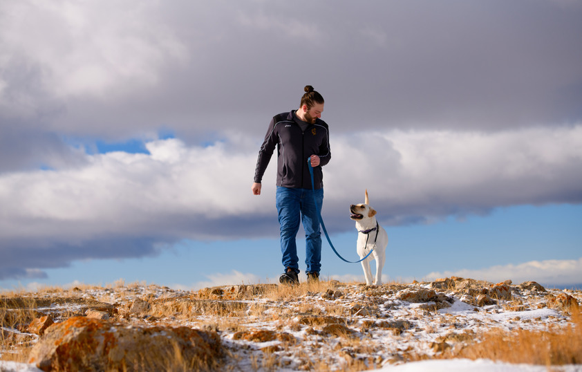 Student walking dog