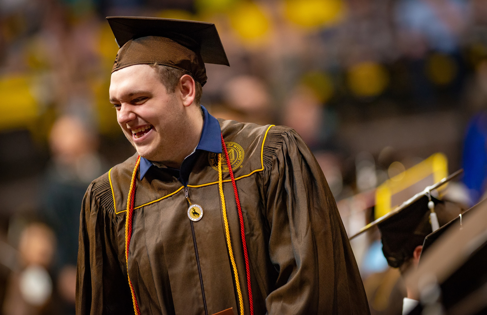 Student smiling at commencement