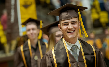 Student smiling during commencement