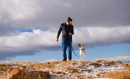 Graduate assistant walking dog