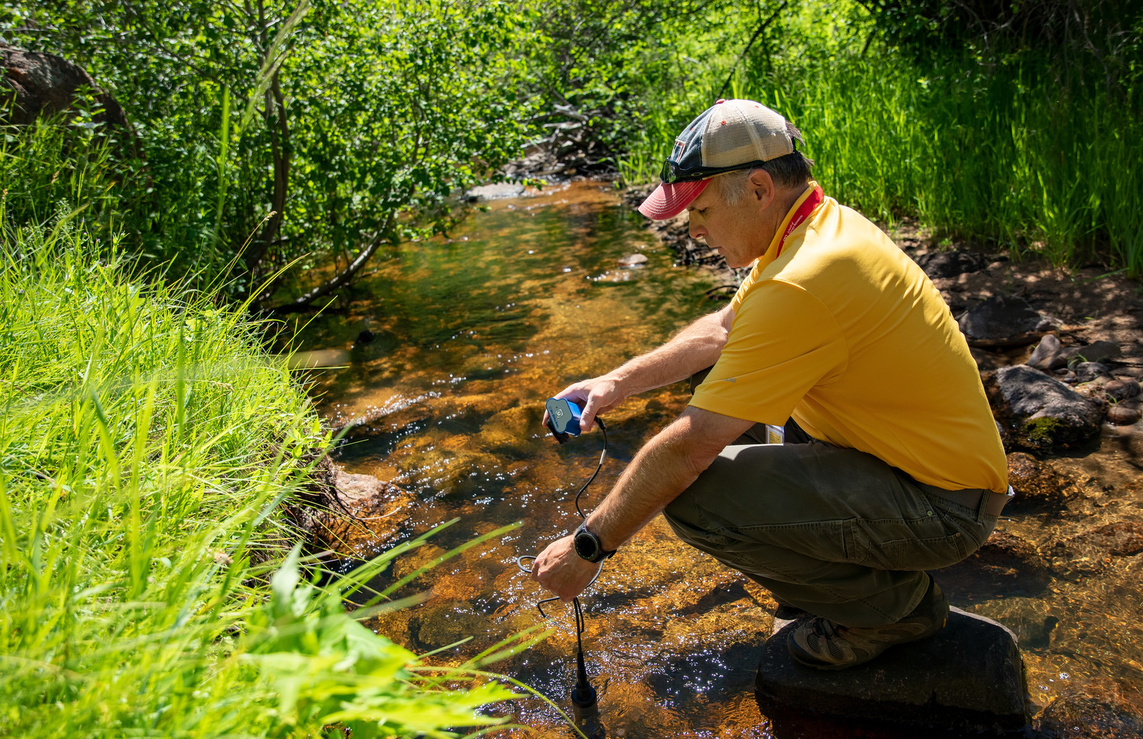 Researcher in pond