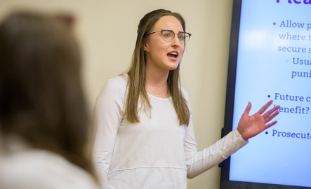 Pre law student gives a presentation to a class
