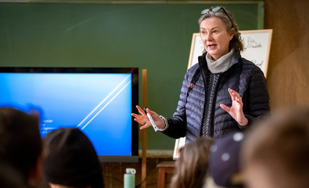 An international studies professor teaches a study abroad class