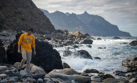 Student walking on rocks