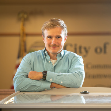 An environmental lawyer smiles for a photo