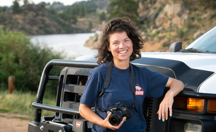 Photo journalist posing with their camera