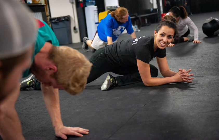 Fitness instructor stretching