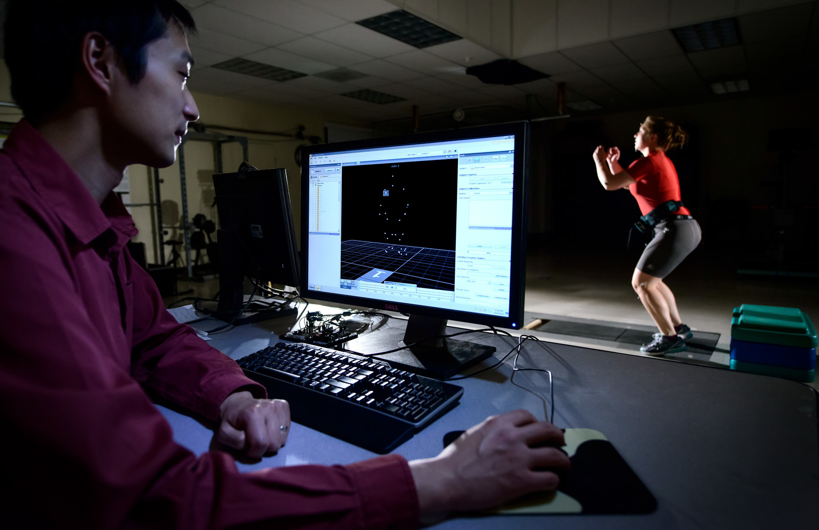 Professor working with student in lab