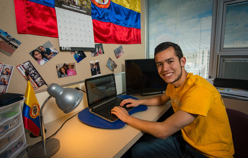 Student on laptop in dorm room