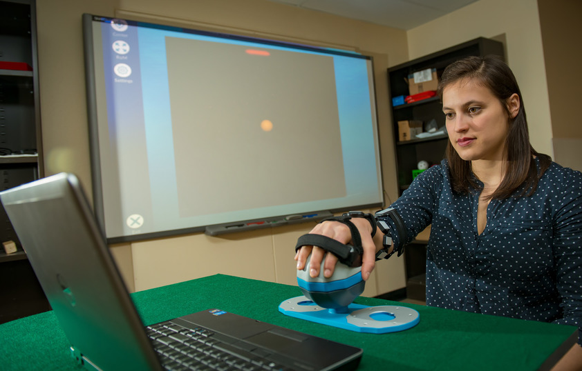 Student with hand device