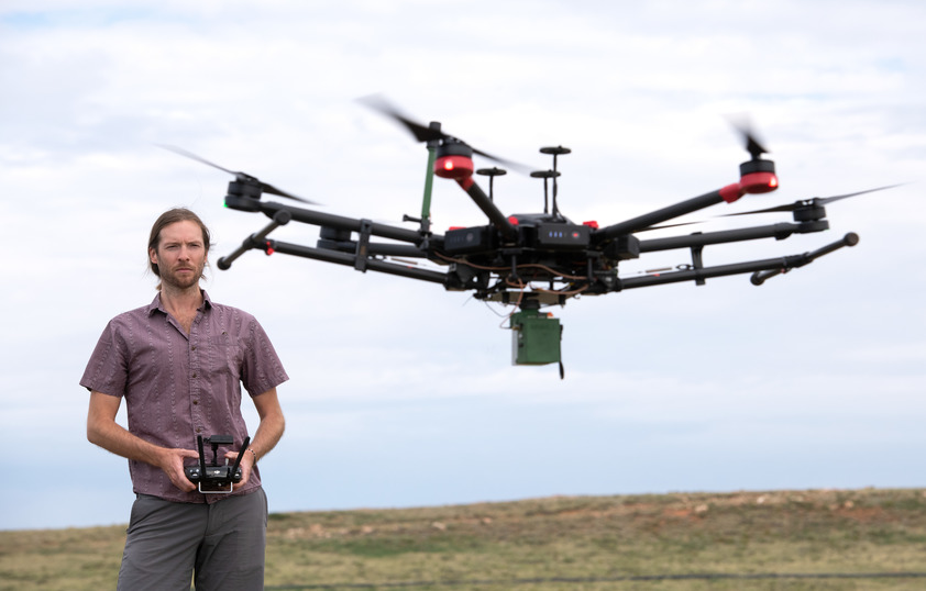 Faculty member flying drone