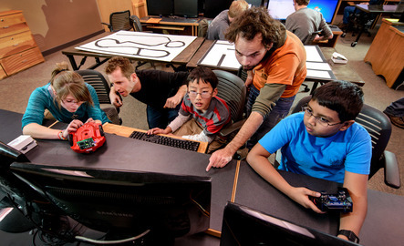A couple of teachers help out students