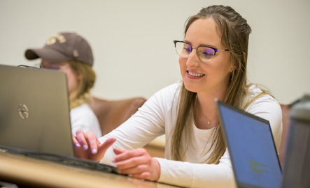 Student works on their computer