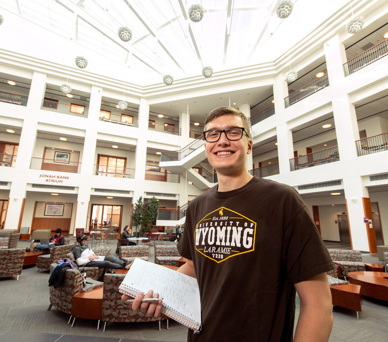 Student in the College of business Atrium 