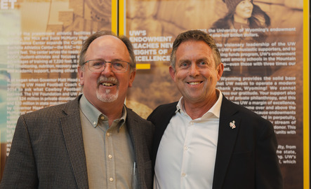 Two marketing professors smile for the camera