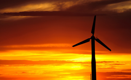 Wind turbine in front of a Wyoming sunset